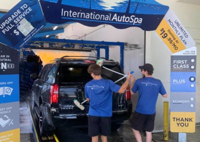International Auto Spa employees washing car
